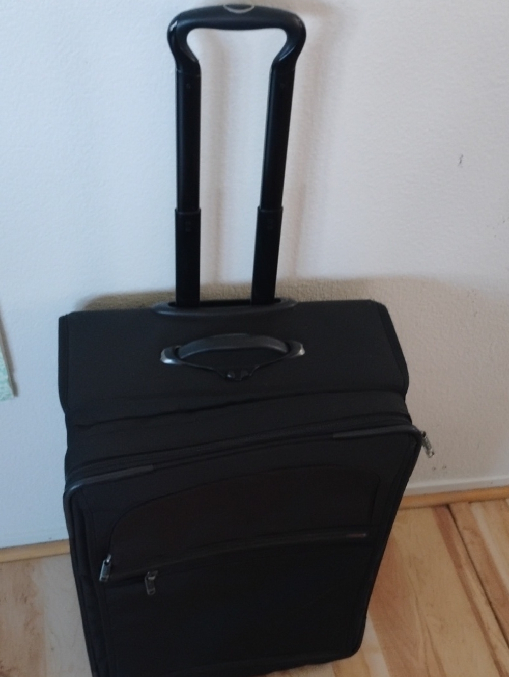 Tumi  G4 Telescoping Handle Black Rolling Suitcase.. Approximately 24 By 18..
